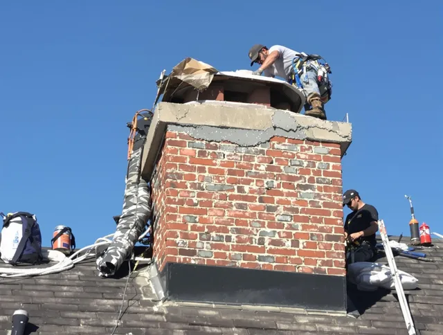 St. Petersburg Chimney Sweep installing a custom chimney crown in St. Petersburg, FL