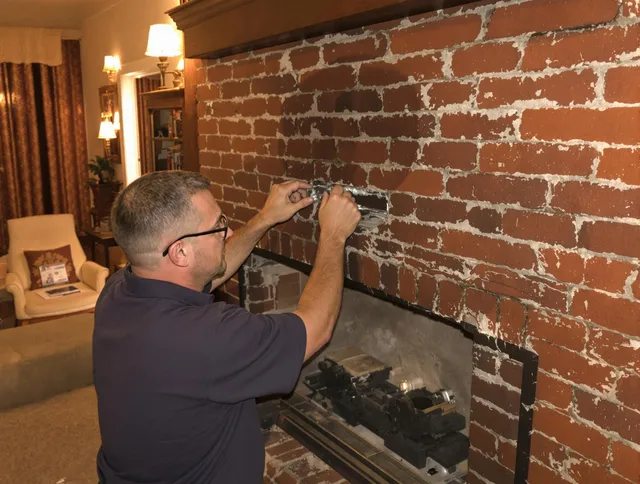 St. Petersburg Chimney Sweep expert fixing a fireplace in St. Petersburg, FL